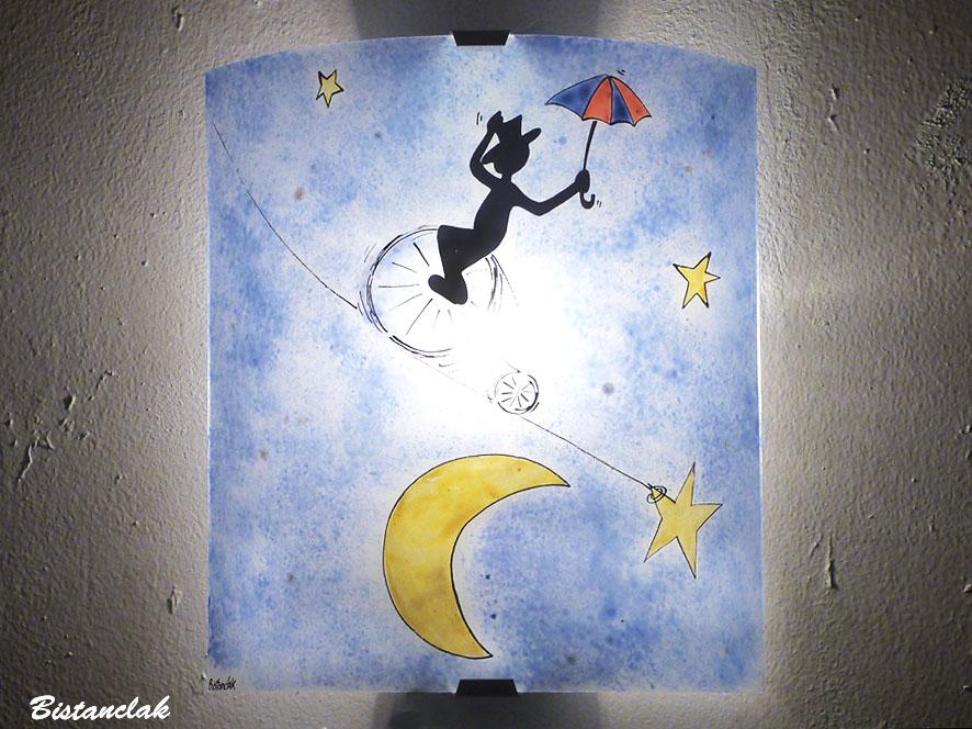 Applique murale colorée bleu au motif fantaisie le funambule et la lune
